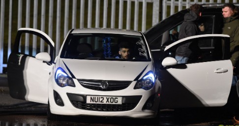 Image: Malik in his car.